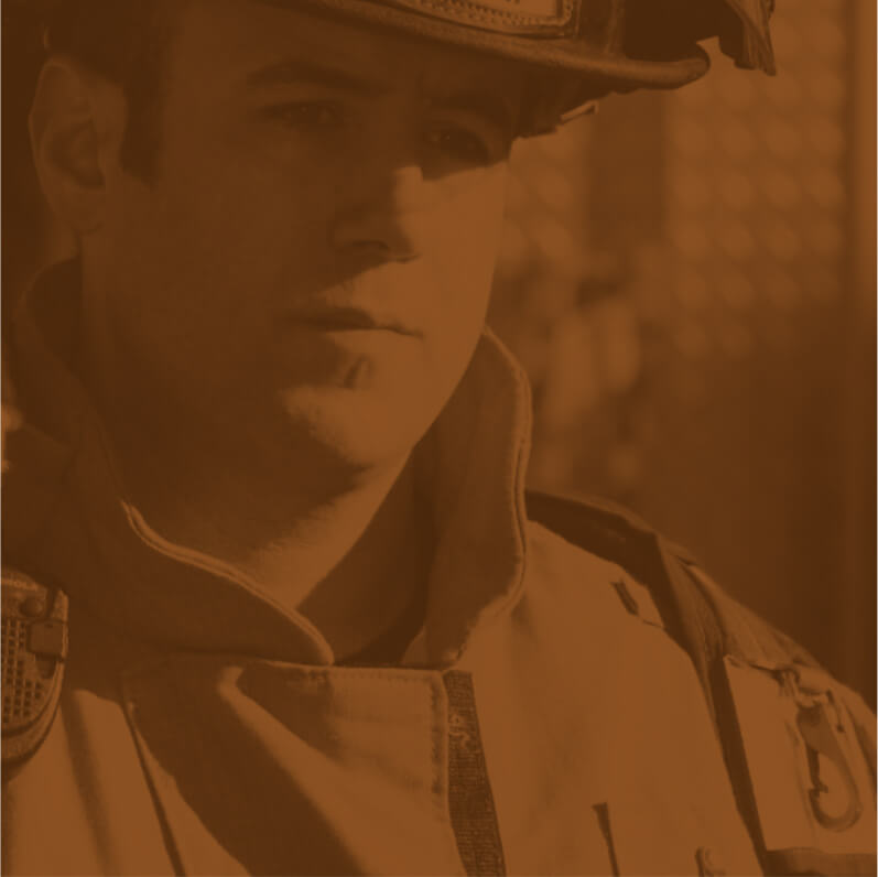 A man in uniform is looking at the camera.